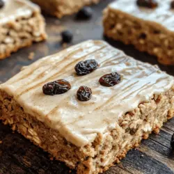 Oatmeal Raisin Cookie Bars with Maple Cinnamon Frosting are a delightful twist on the classic cookie recipe, combining the hearty texture of oatmeal with the sweetness of raisins and an irresistibly creamy maple cinnamon frosting. These bars are not just a dessert; they evoke a sense of nostalgia, reminiscent of warm, home-baked treats shared with family and friends. Whether you're preparing for a cozy gathering, a holiday celebration, or simply looking to indulge in a comforting dessert, these cookie bars are perfect for any occasion.